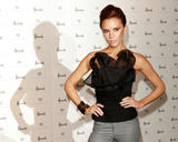 Victoria Beckham in very tight jeans and black top launches the first global concession of her dVb label at Harrods in London